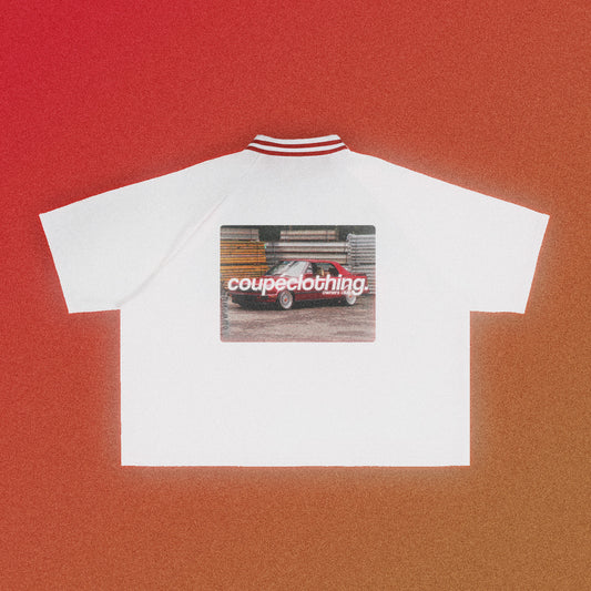 Back of the white 'Owners Club Varsity' jersey, which features a contrast red collar. The design features the 'Owners Club' logo above a red car design.