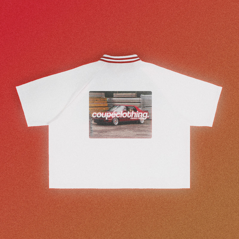 Back of the white 'Owners Club Varsity' jersey, which features a contrast red collar. The design features the 'Owners Club' logo above a red car design.